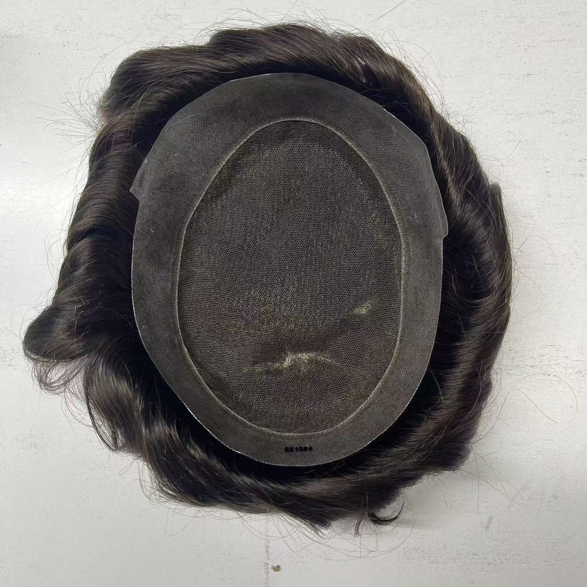 Full back inside view of Australia system showing base structure with long wavy dark hair