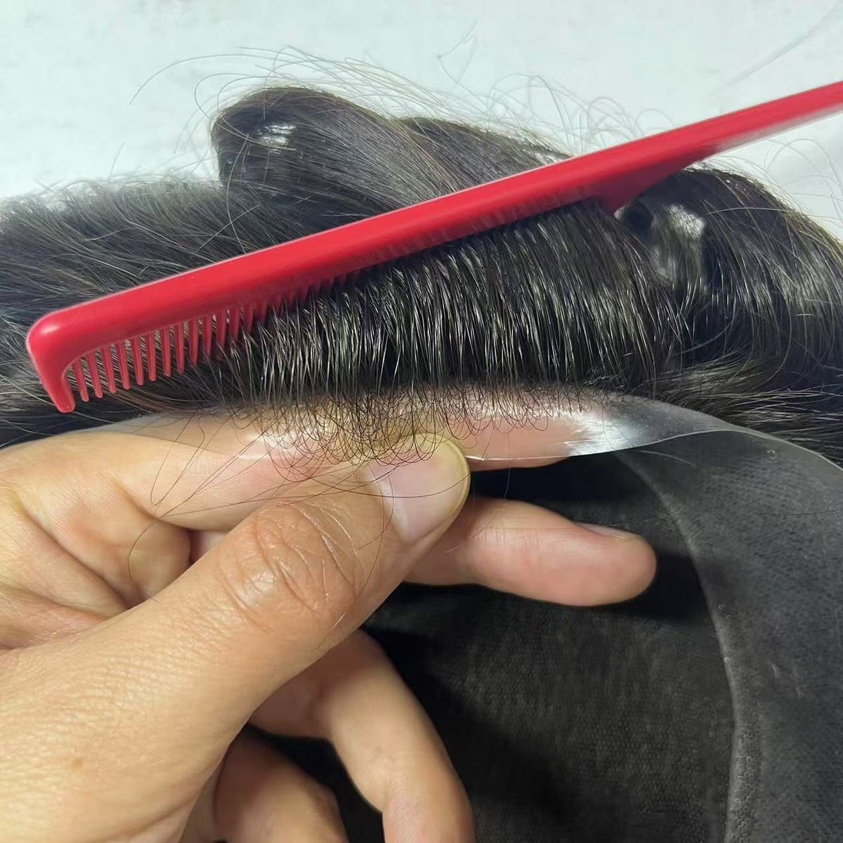 French lace front with red comb showing hand-tied baby hairs on fine transparent mesh