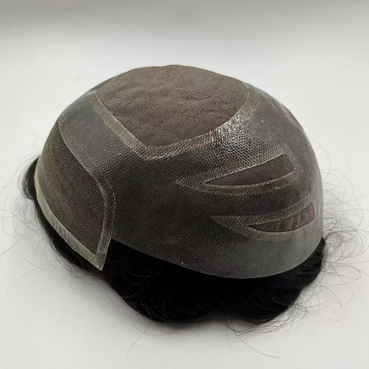 Mono system side-back view showing monofilament mesh crown, ventilation and lace front