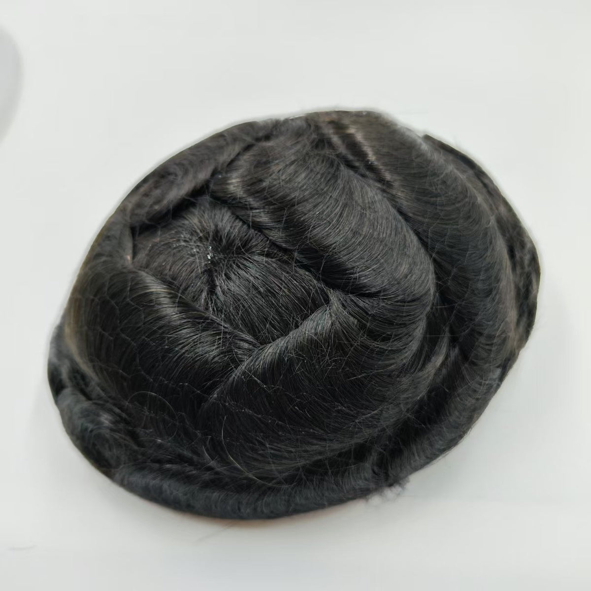 Top-down crown view showing natural hair parting and realistic scalp effect