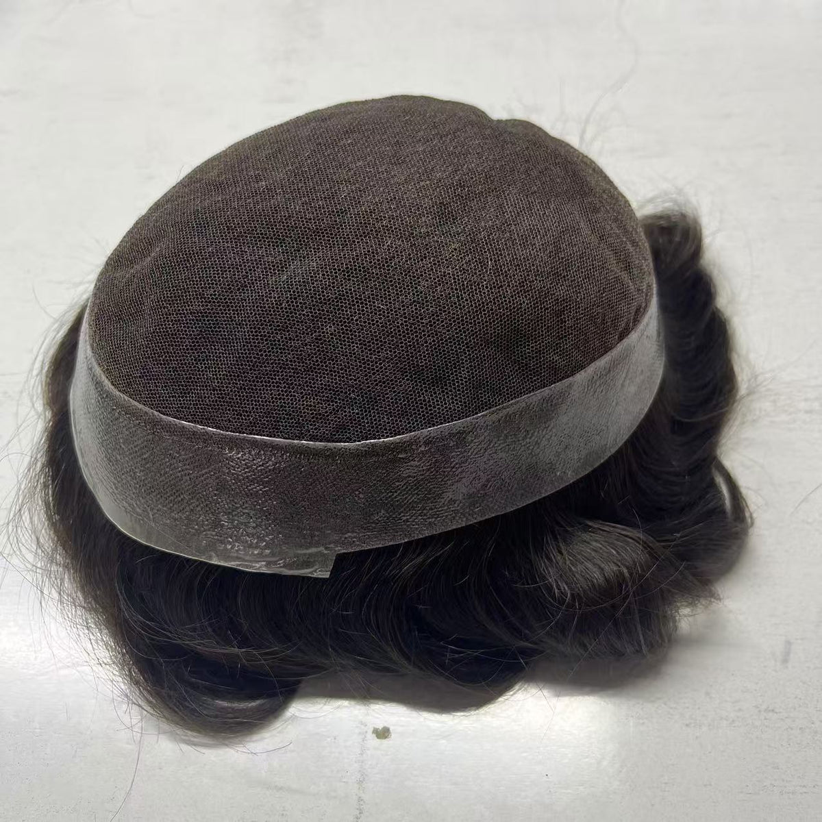 Back-top view of Australia base showing poly mesh and lace front with wavy dark hair