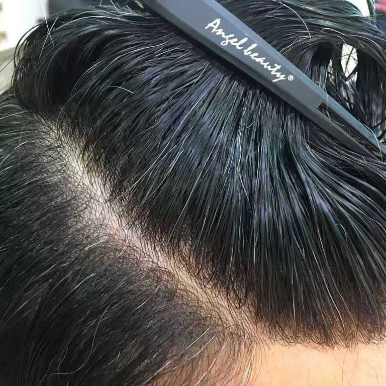 Worn center part showing ultra-thin base with realistic scalp color through hair part