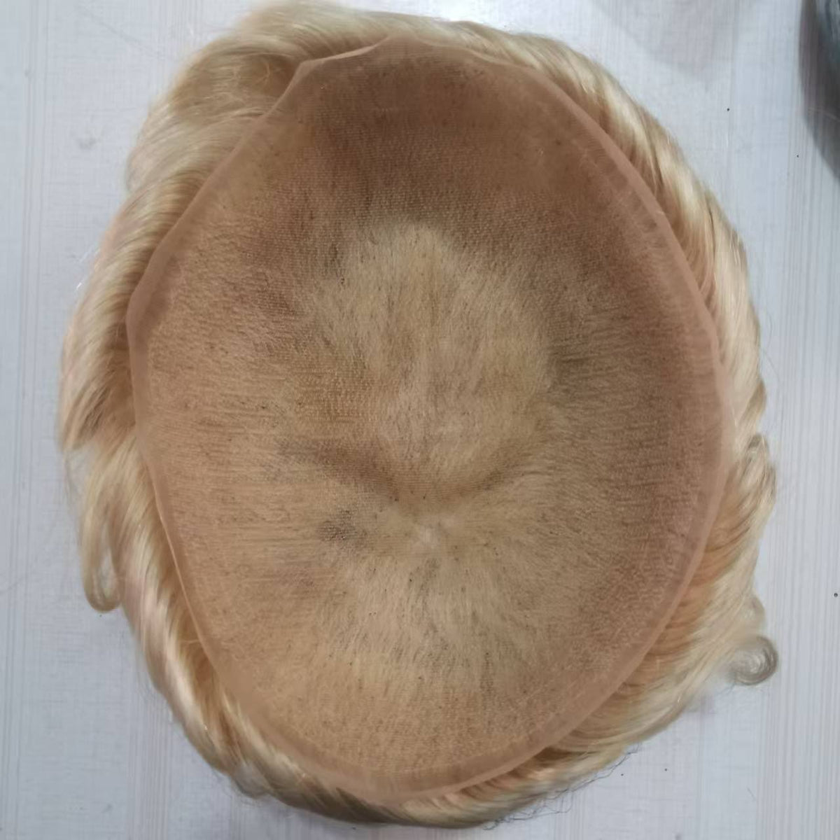 Full French lace base top view showing uniform fine skin-tone lace covering entire cap